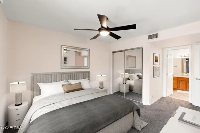 a bedroom with a bed and white walls