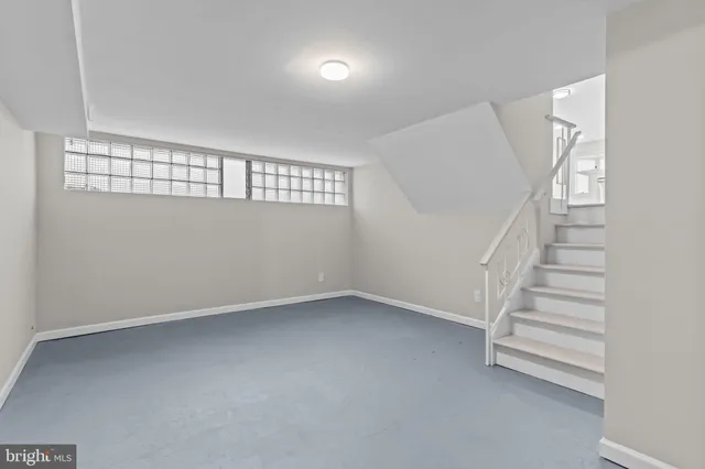 a view of an empty room with stairs