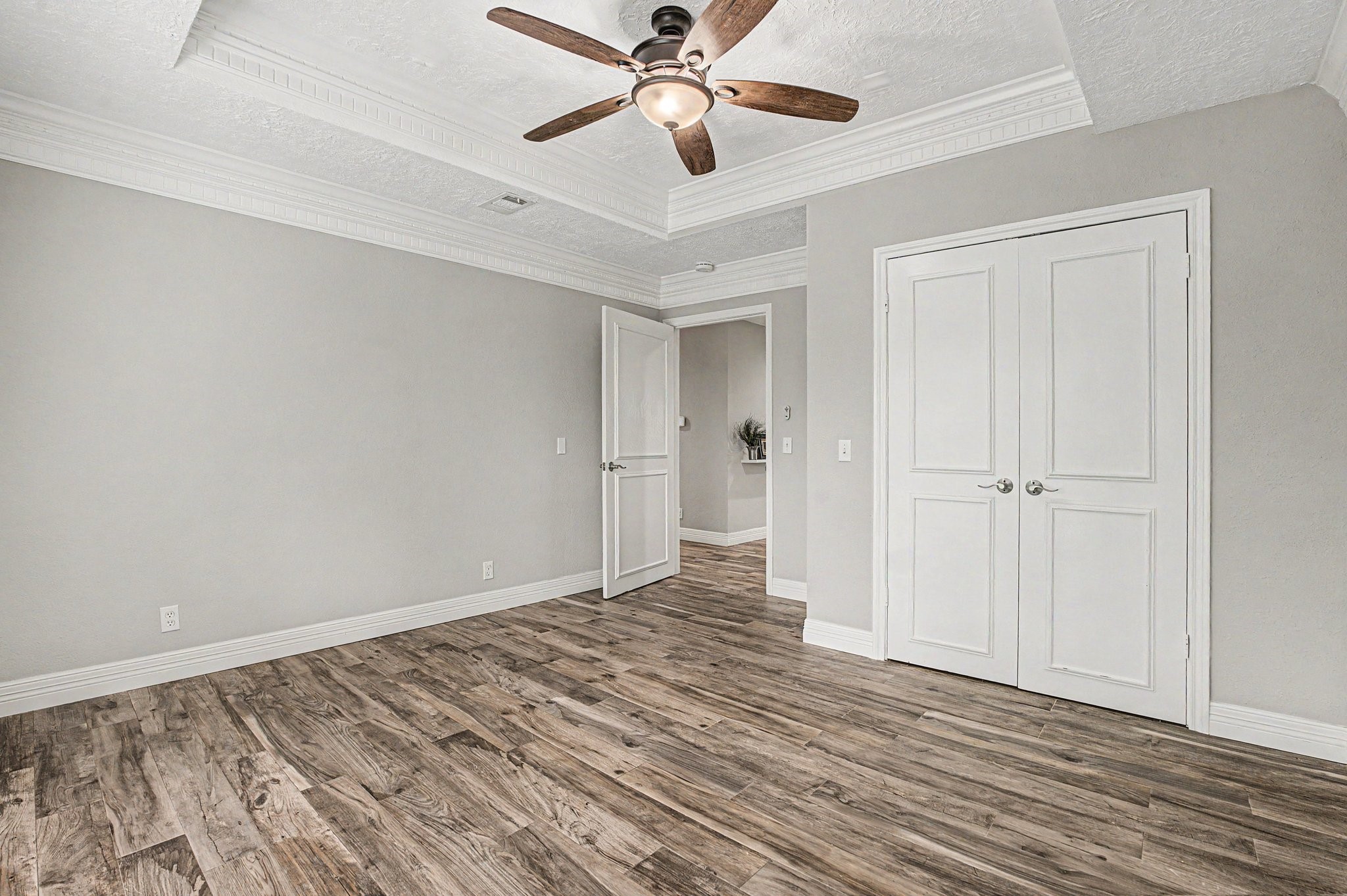 35564 Brumlow Road Hempstead, TX 77445 - Photo 20 of 46 a view of a room with wooden floor and a ceiling fan