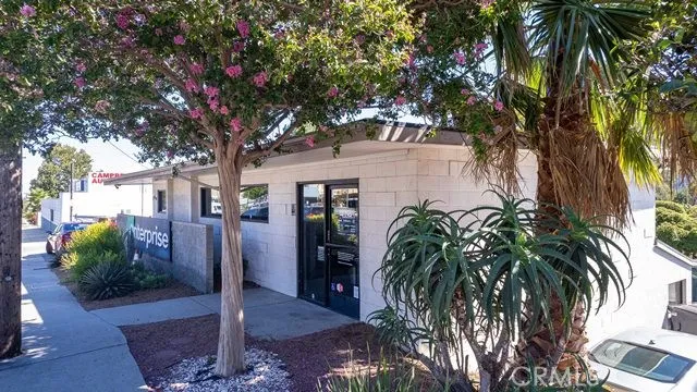 a view of a house with a tree