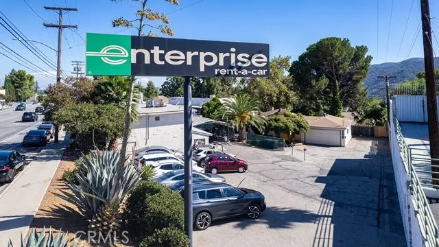 a sign board with a small yard