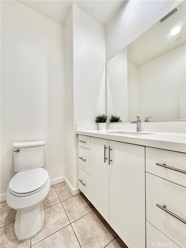 21042 Cornerstone Drive Walnut, CA 91789 - Photo 11 of 29 a bathroom with a toilet sink and mirror