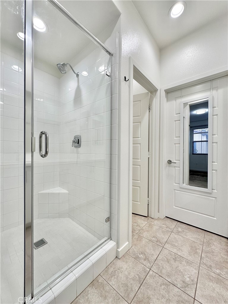 21042 Cornerstone Drive Walnut, CA 91789 - Photo 18 of 29 a bathroom with a glass shower door and a sink
