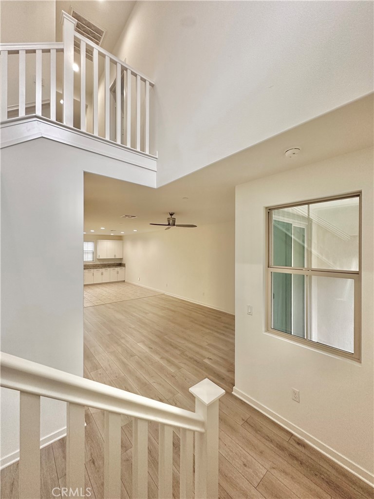 21042 Cornerstone Drive Walnut, CA 91789 - Photo 25 of 29 a view of an empty room with wooden floor and a window
