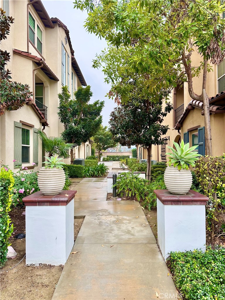 21042 Cornerstone Drive Walnut, CA 91789 - Photo 28 of 29 a front view of a house with a garden and outdoor seating