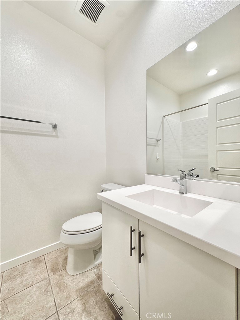 21042 Cornerstone Drive Walnut, CA 91789 - Photo 4 of 29 a bathroom with a sink a toilet and mirror