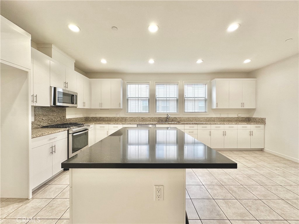 21042 Cornerstone Drive Walnut, CA 91789 - Photo 9 of 29 a large kitchen with stainless steel appliances granite countertop a granite counter tops and a sink