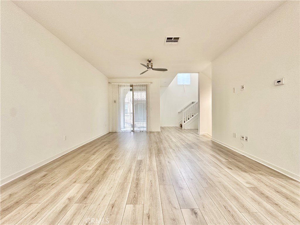21042 Cornerstone Drive Walnut, CA 91789 - Photo 10 of 29 a view of a room with wooden floor and white walls