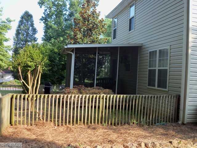 7600 Keating Drive Oak Ridge, NC 27310 - Photo 9 of 13 Enclosed Porch. Fenced yard and screened porch