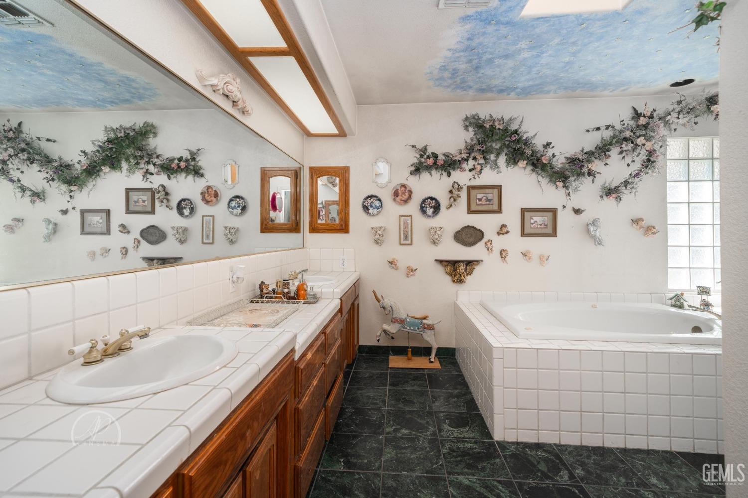 Undisclosed Address Taft, CA 93268 - Photo 15 of 38 a bathroom with a sink a bathtub and a shower