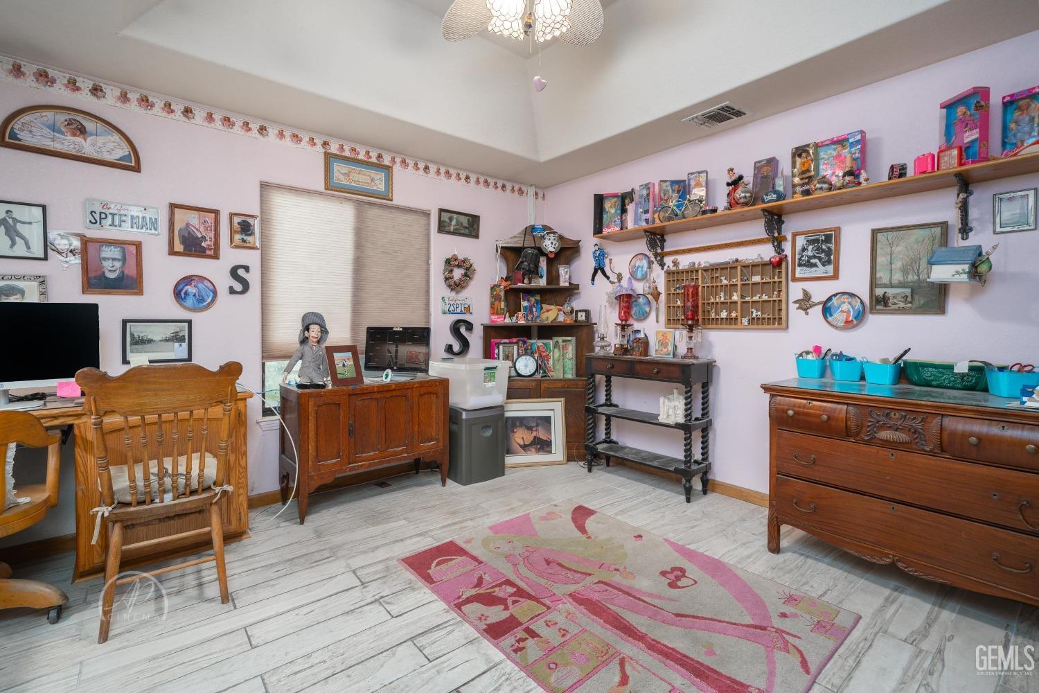 Undisclosed Address Taft, CA 93268 - Photo 17 of 38 a bedroom with furniture and a wooden floor