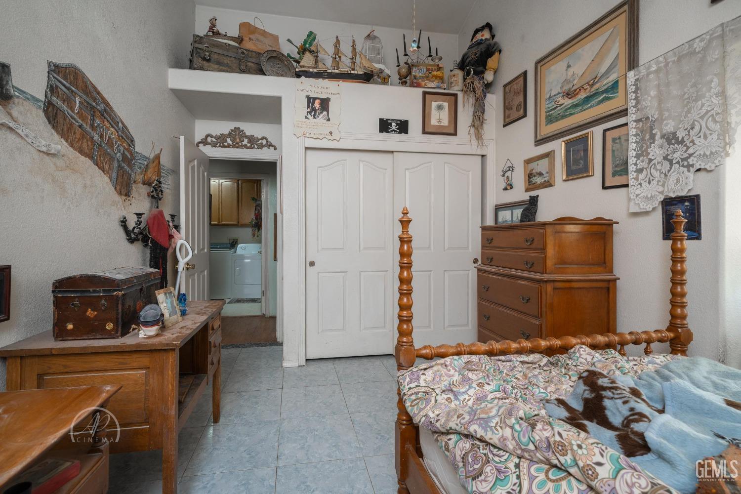 Undisclosed Address Taft, CA 93268 - Photo 21 of 38 a bedroom with a bed and a table in it