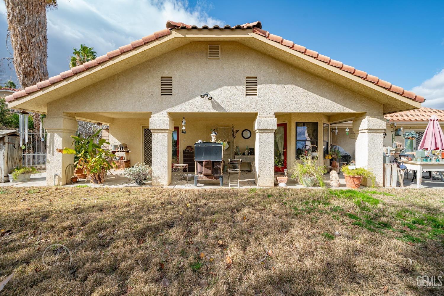 Undisclosed Address Taft, CA 93268 - Photo 26 of 38 a front view of a house with a yard