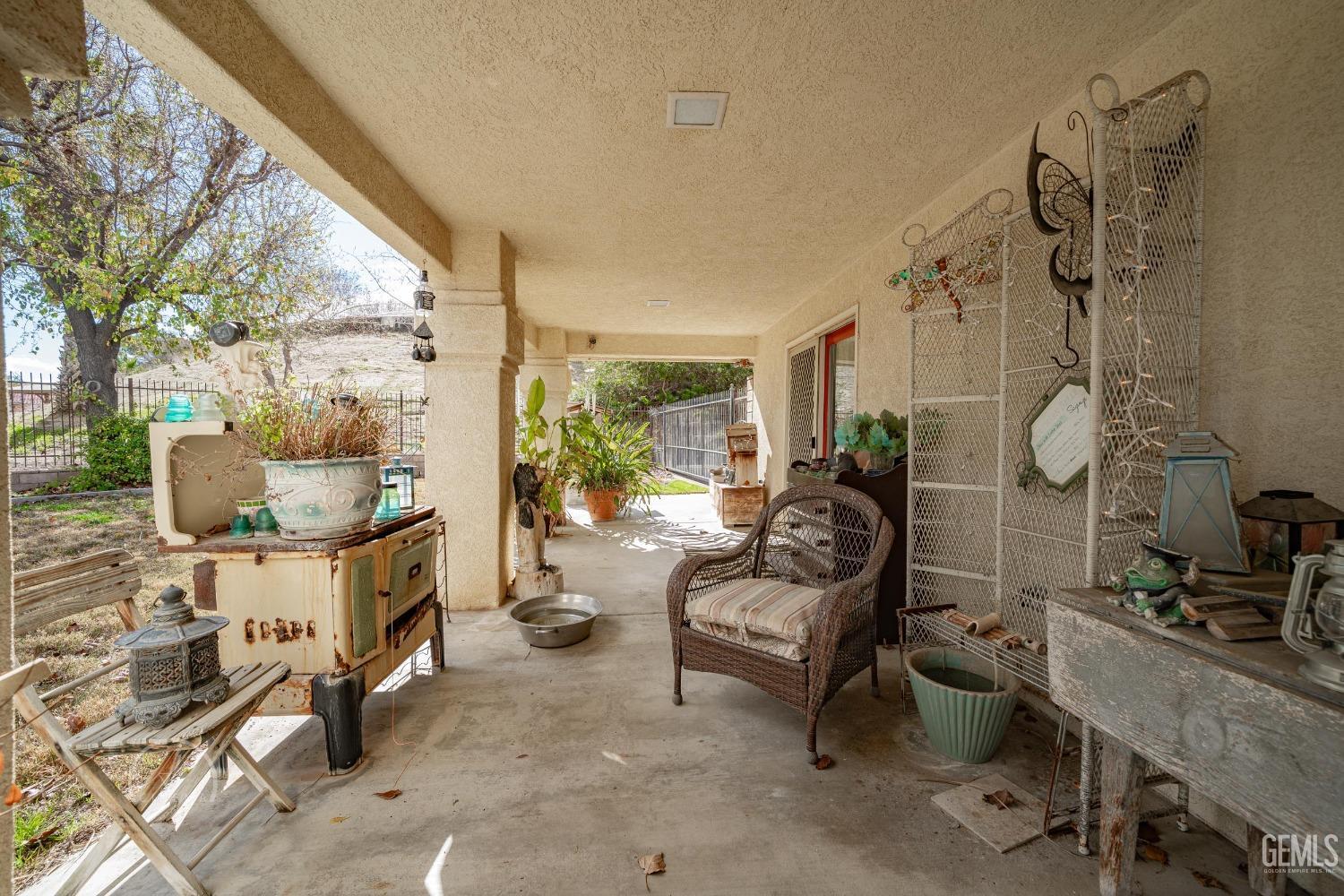 Undisclosed Address Taft, CA 93268 - Photo 27 of 38 a living room with furniture and a fireplace
