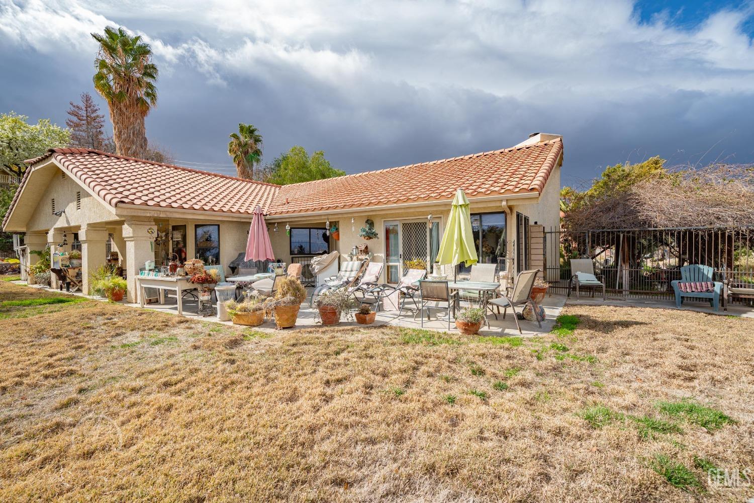 Undisclosed Address Taft, CA 93268 - Photo 28 of 38 a view of a dinning table and chairs in the patio of the house