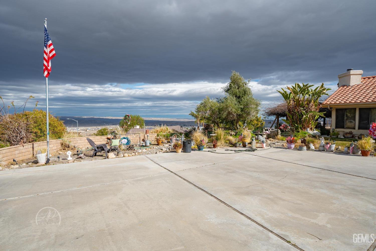 Undisclosed Address Taft, CA 93268 - Photo 4 of 38 a view of a street with a bike and cars