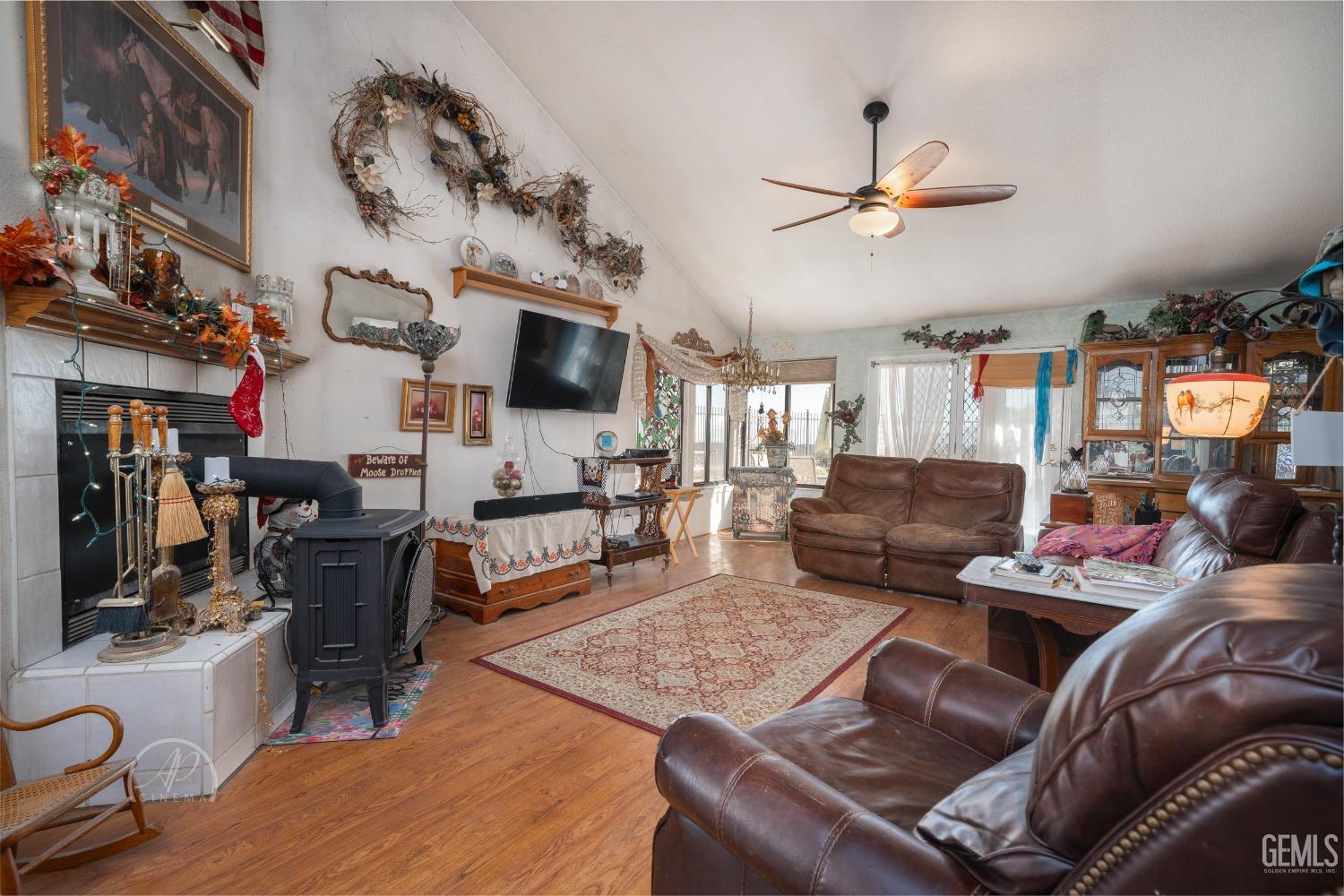 Undisclosed Address Taft, CA 93268 - Photo 6 of 38 a living room with furniture and a flat screen tv