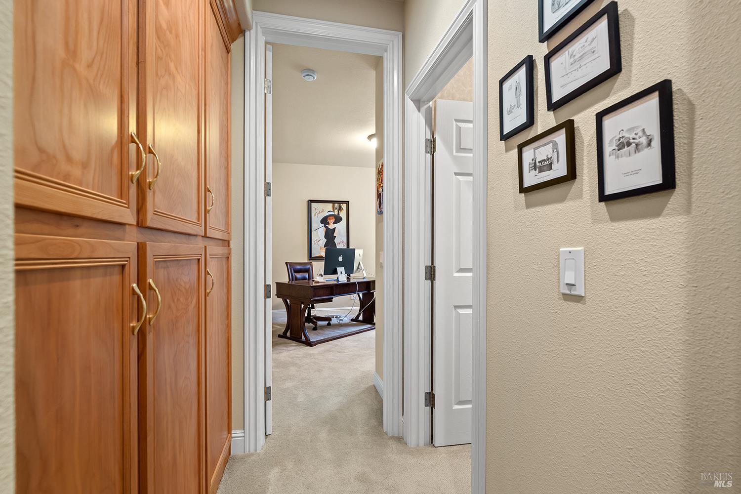 3696 Newbury Court Santa Rosa, CA 95404 - Photo 15 of 52 a view of a hallway with paintings on the wall