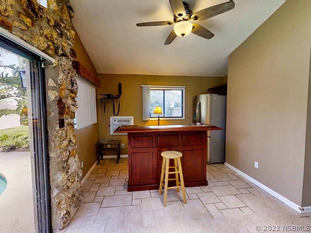 401 East Citrus Street Altamonte Springs, FL 32701 - Photo 13 of 36 a room with furniture and a chandelier