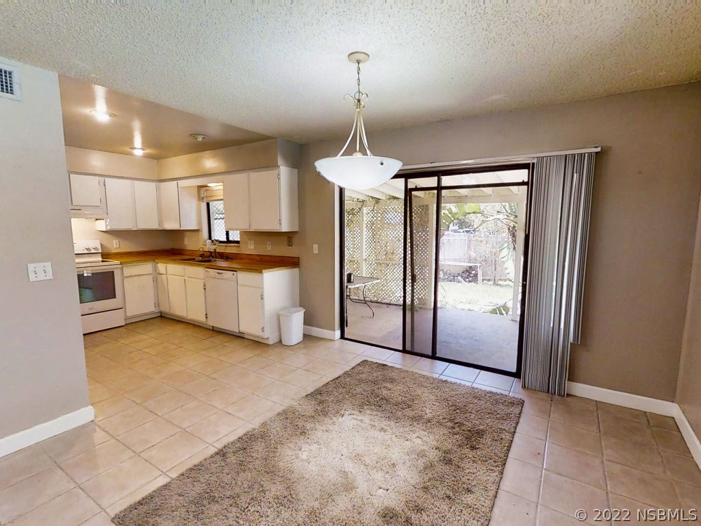 401 East Citrus Street Altamonte Springs, FL 32701 - Photo 16 of 36 a kitchen with stainless steel appliances granite countertop a stove and a refrigerator