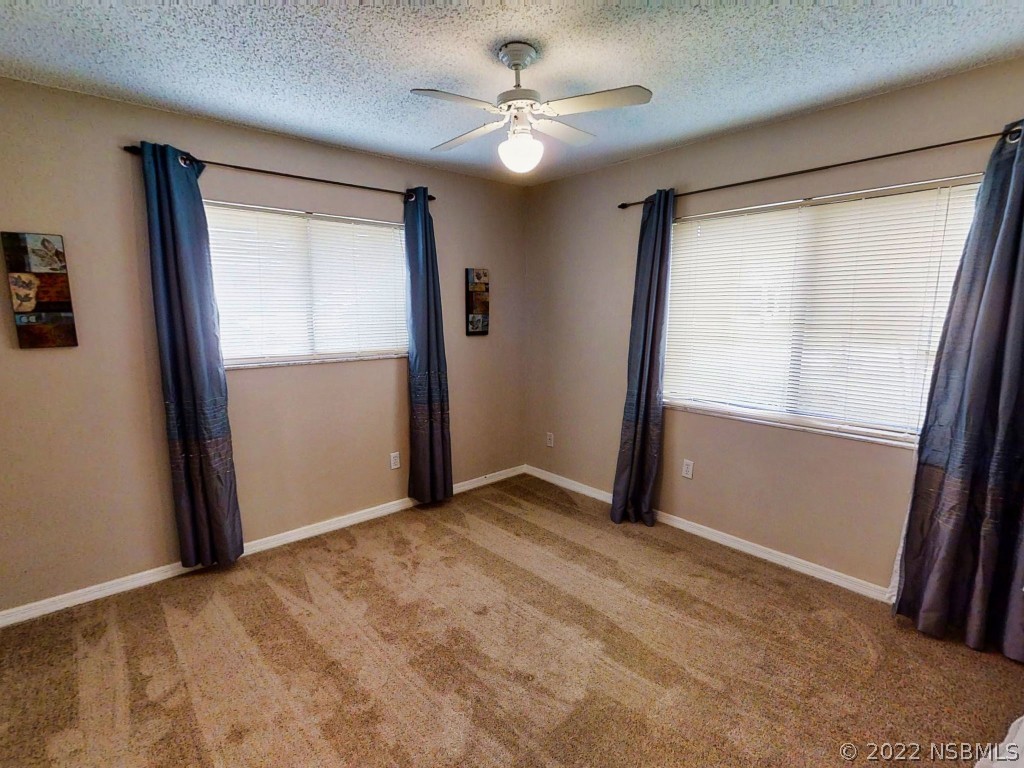 401 East Citrus Street Altamonte Springs, FL 32701 - Photo 24 of 36 an empty room with windows and closet