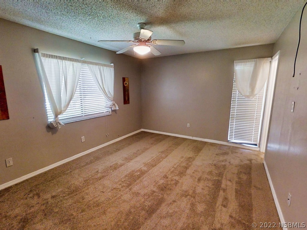 401 East Citrus Street Altamonte Springs, FL 32701 - Photo 25 of 36 an empty room with windows and closet