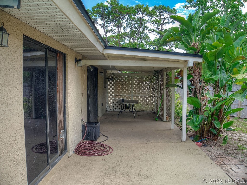 401 East Citrus Street Altamonte Springs, FL 32701 - Photo 36 of 36 a backyard of a house with barbeque oven table and chairs