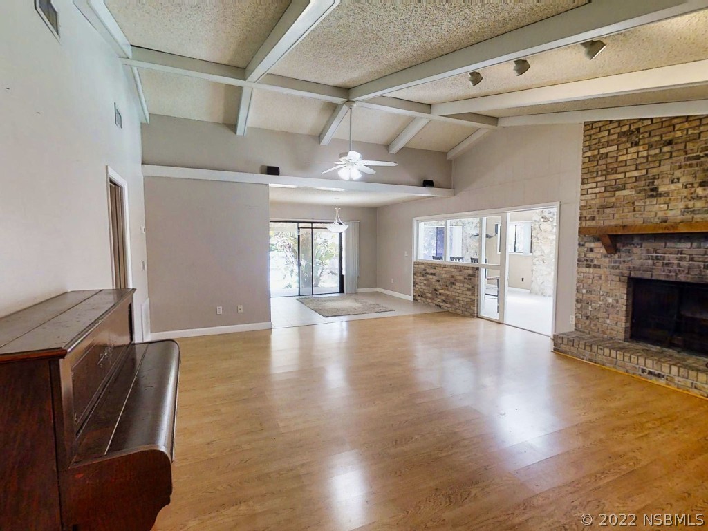 401 East Citrus Street Altamonte Springs, FL 32701 - Photo 8 of 36 a view of a livingroom with furniture a fireplace and wooden floor