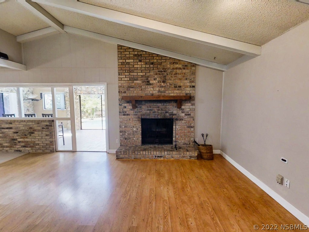 401 East Citrus Street Altamonte Springs, FL 32701 - Photo 9 of 36 a view of an empty room with a fireplace and a window