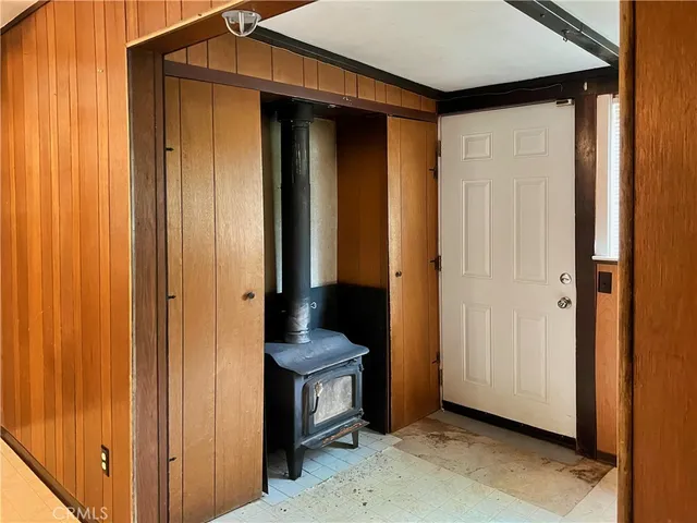 a view of a hallway with closet and a door