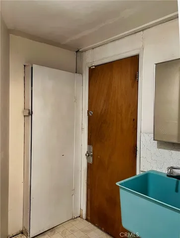 a bathroom with a shower and a sink