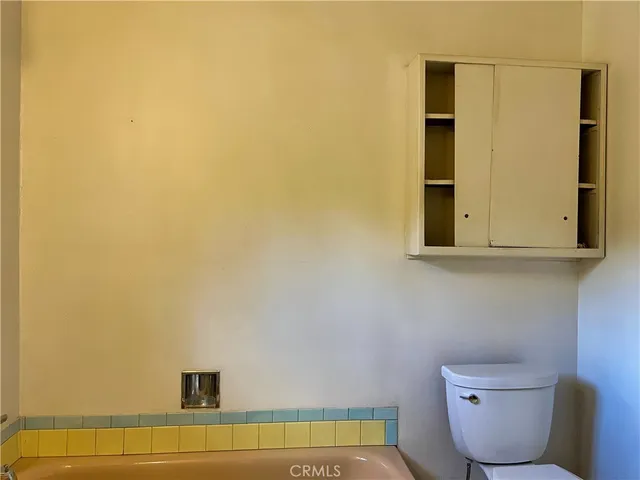 a bathroom with a toilet and a sink