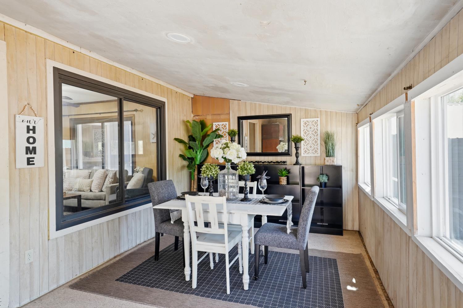 13351 Newtown Road Nevada City, CA 95959 - Photo 3 of 50 a view of a dining room with furniture and a potted plant