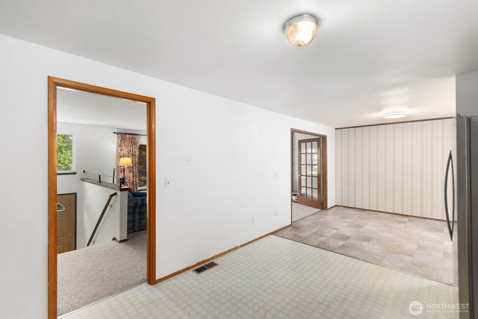 21627 9th Place West Bothell, WA 98021 - Photo 18 of 40 a view of a livingroom with wooden floor and a ceiling fan