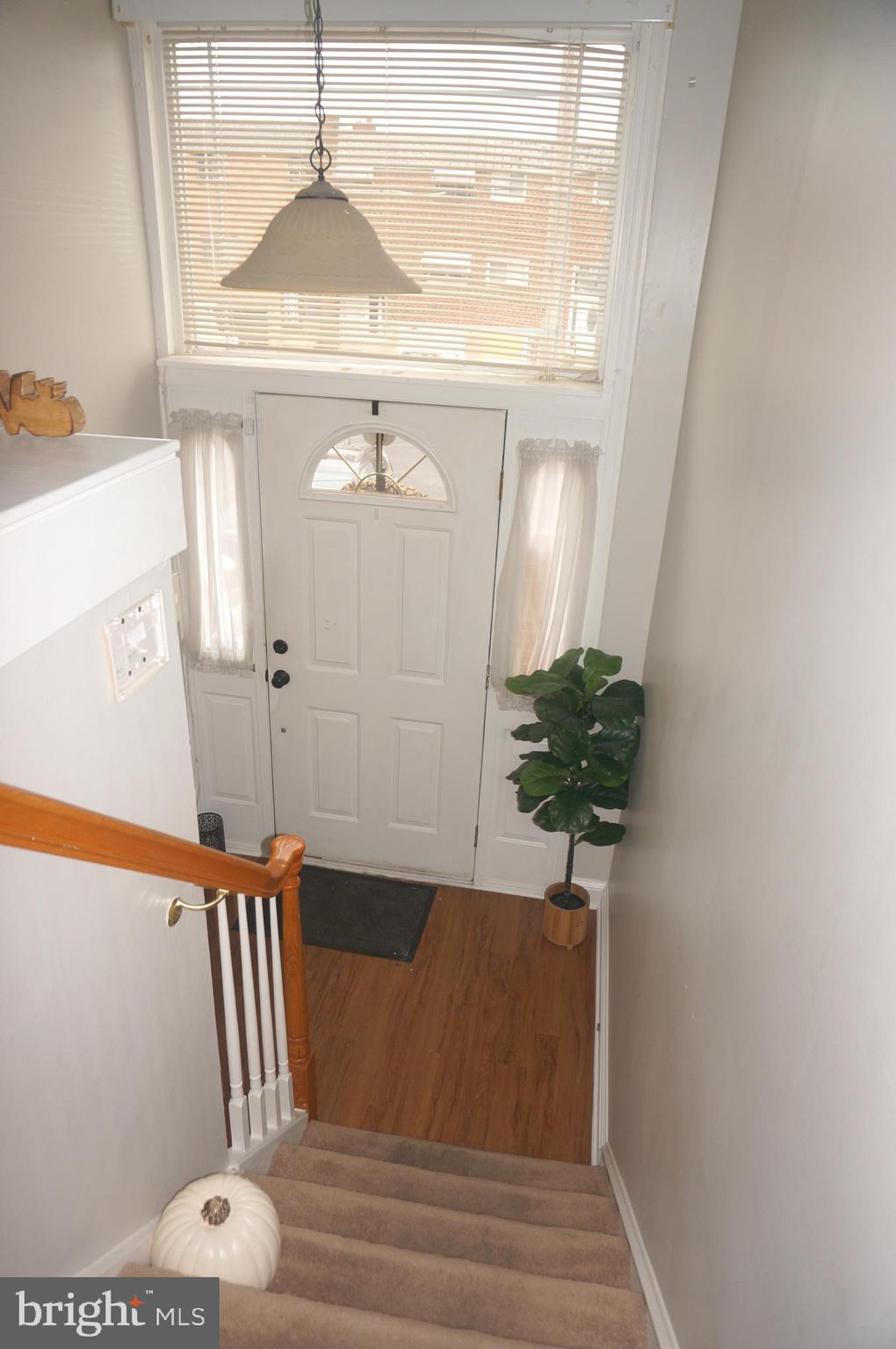 3599 C Nottingham Lane Philadelphia, PA 19114 - Photo 11 of 58 a vase of flowers sitting on a table with wooden floor