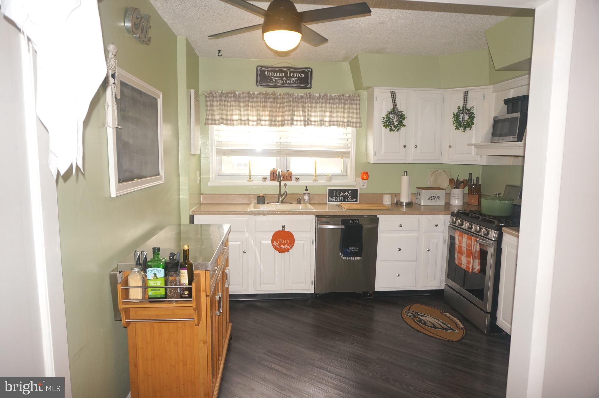 3599 C Nottingham Lane Philadelphia, PA 19114 - Photo 23 of 58 a kitchen with a sink window and cabinets