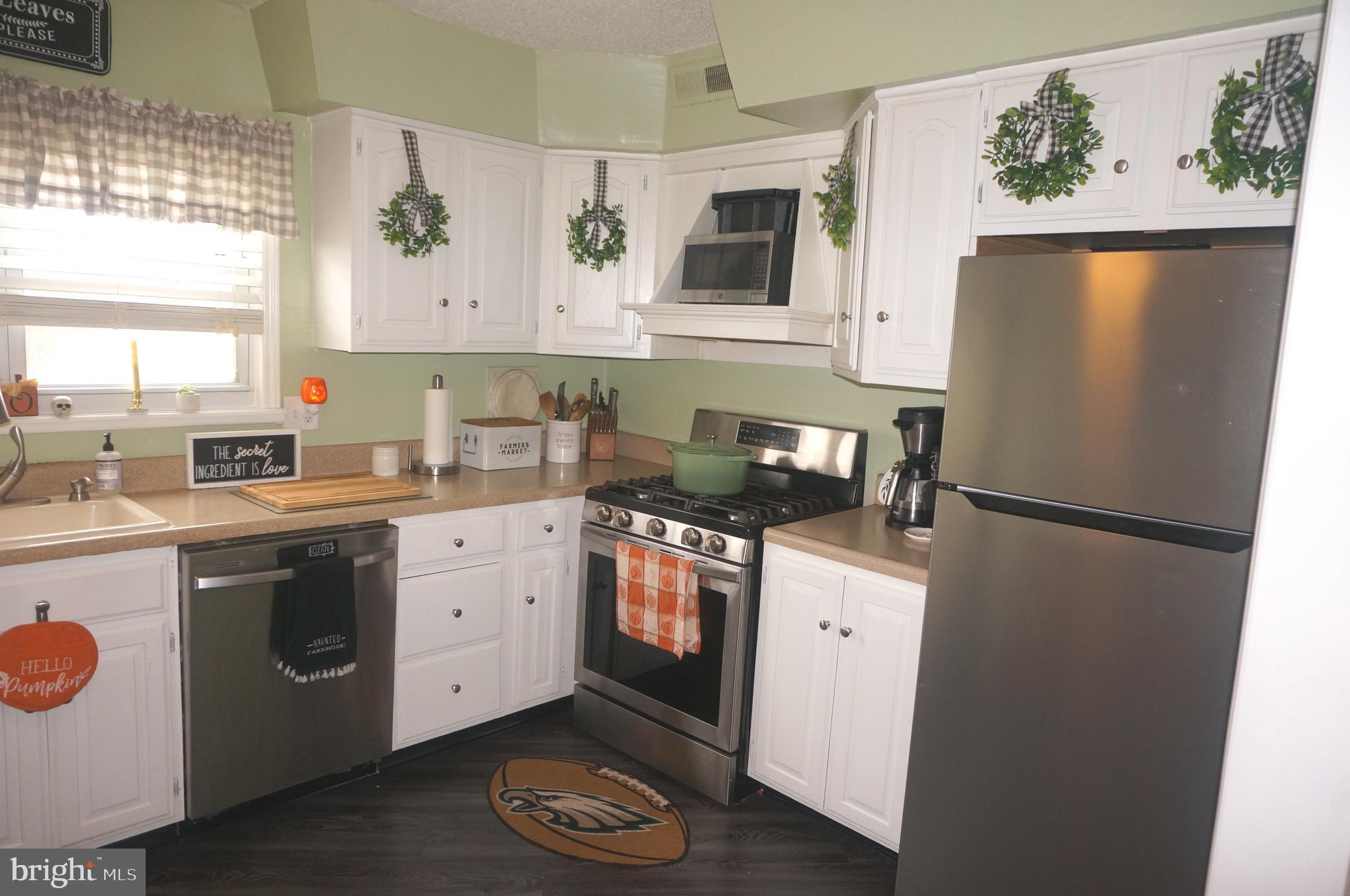 3599 C Nottingham Lane Philadelphia, PA 19114 - Photo 24 of 58 a kitchen with a refrigerator sink and stove