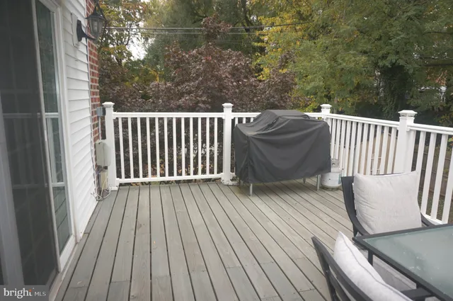 a view of a balcony with wooden floor