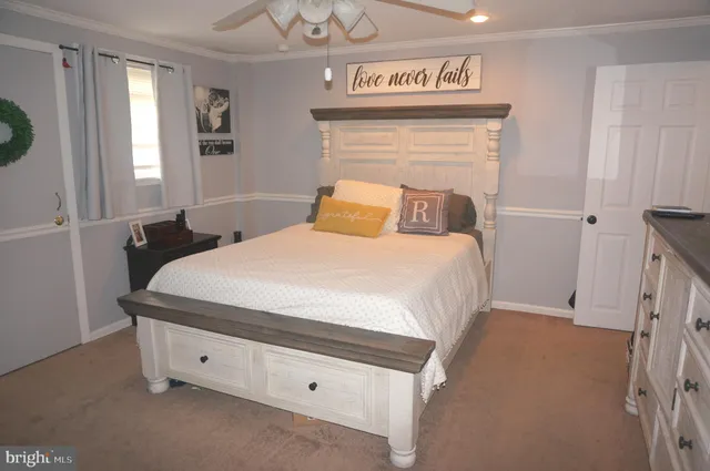 a bathroom with a sink toilet vanity and shower