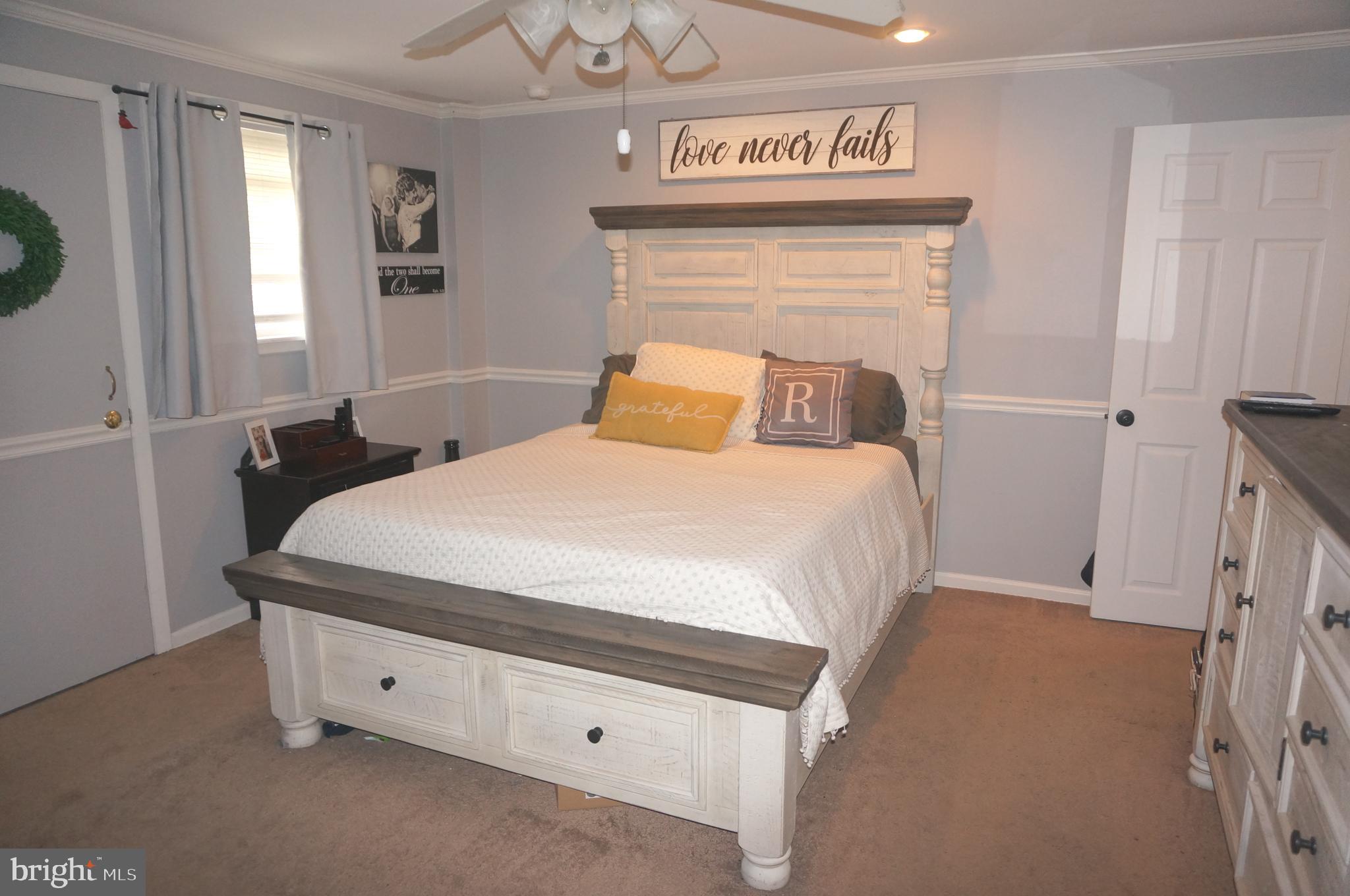 3599 C Nottingham Lane Philadelphia, PA 19114 - Photo 32 of 58 a bedroom with a bed and a window