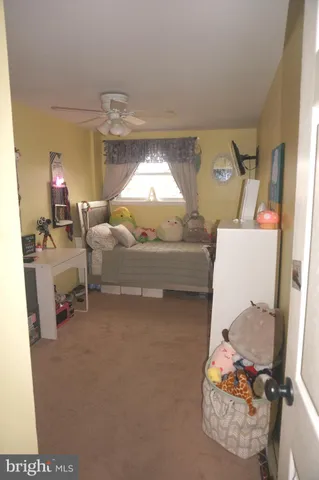 a view of a hallway with furniture and entryway