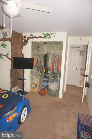 a view of livingroom with furniture and stairs