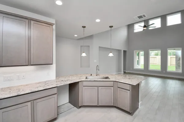 a kitchen with a sink cabinets and window