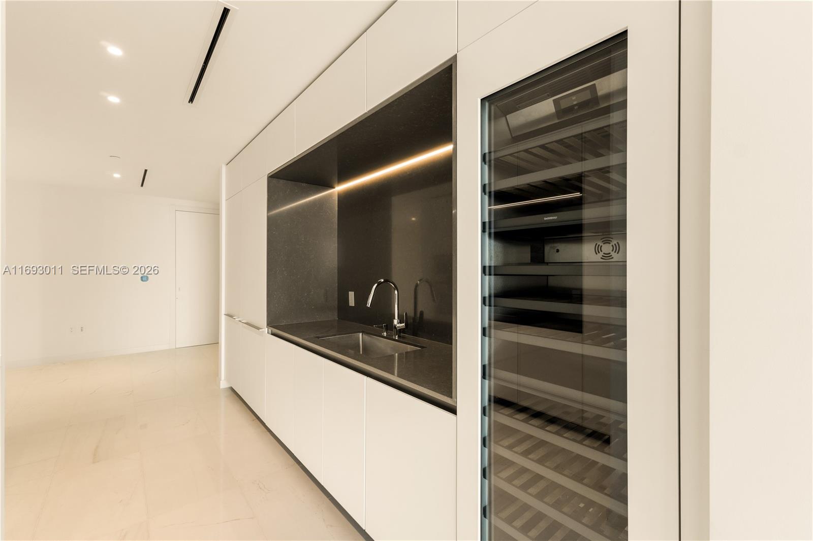 300 Biscayne Blvd Way, Unit 2103 Miami, FL 33131 - Photo 14 of 41 a view of walk in closet and kitchen view