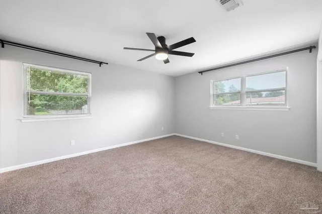 a view of an empty room with a window