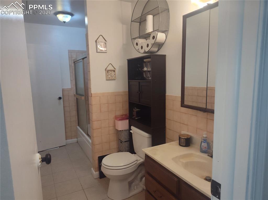 37 Massari Road Pueblo, CO 81001 - Photo 12 of 37 a bathroom with a sink a toilet and shower