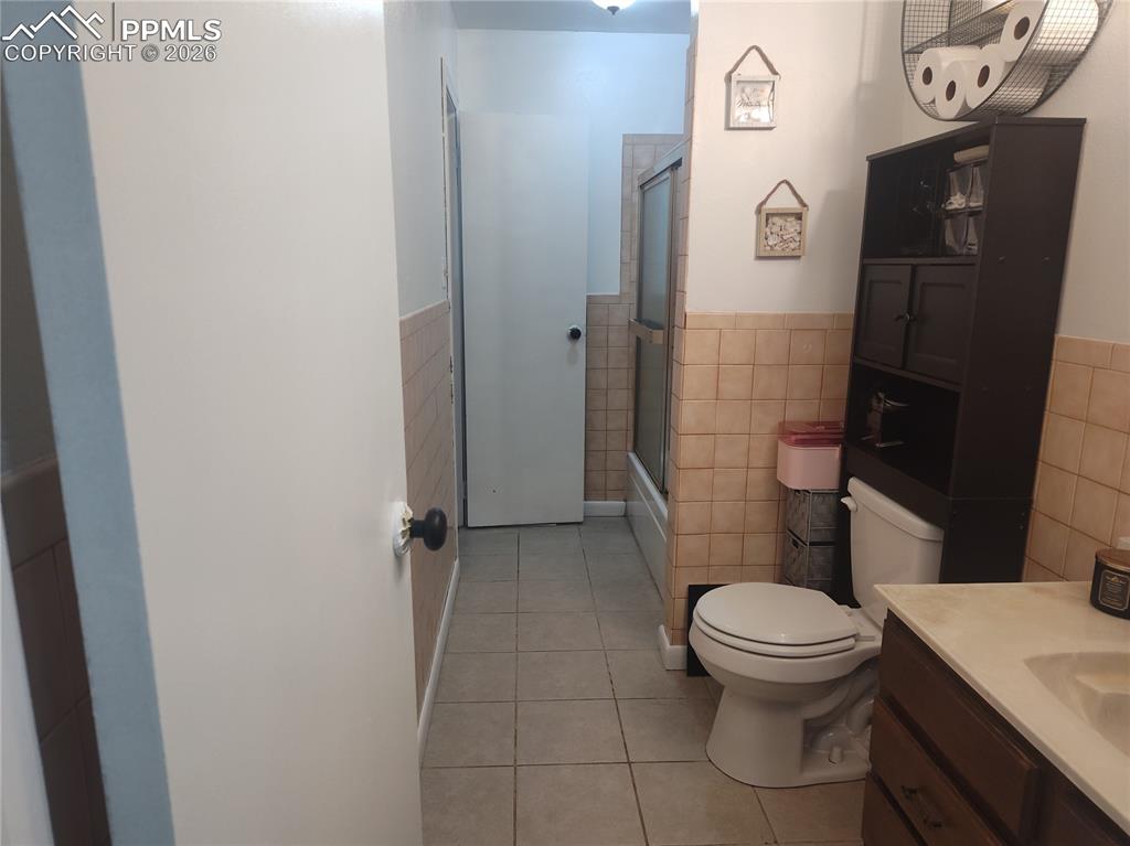 37 Massari Road Pueblo, CO 81001 - Photo 13 of 37 a white toilet sitting next to a bathroom sink