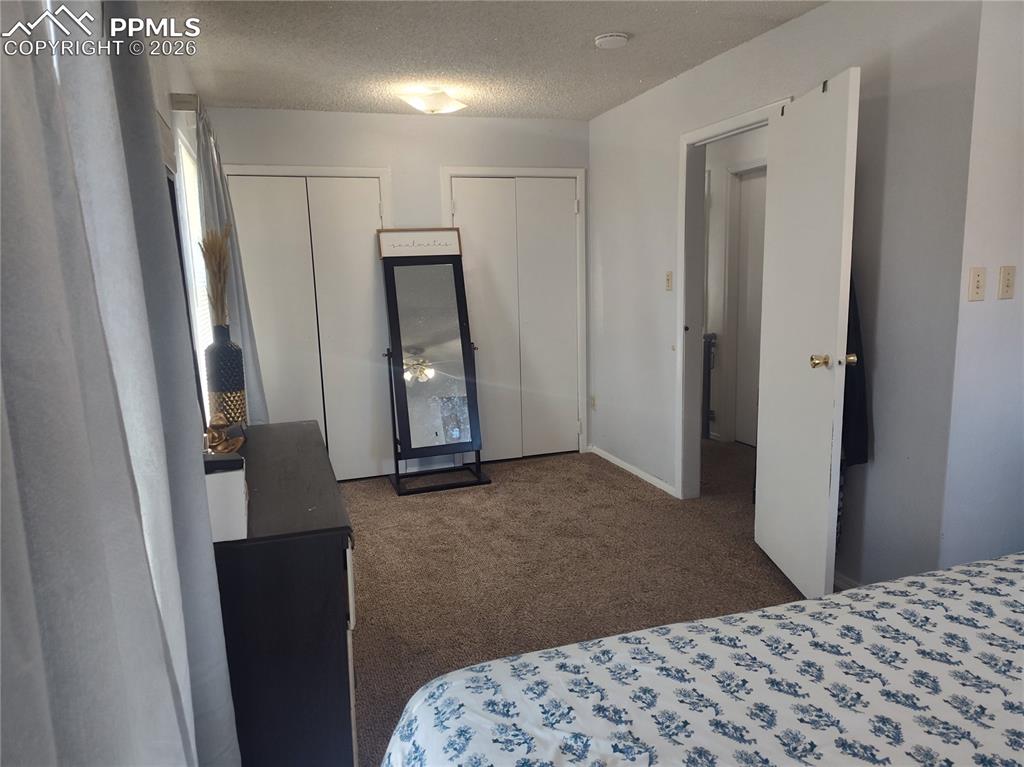 37 Massari Road Pueblo, CO 81001 - Photo 17 of 37 a bedroom with a bed and a dresser