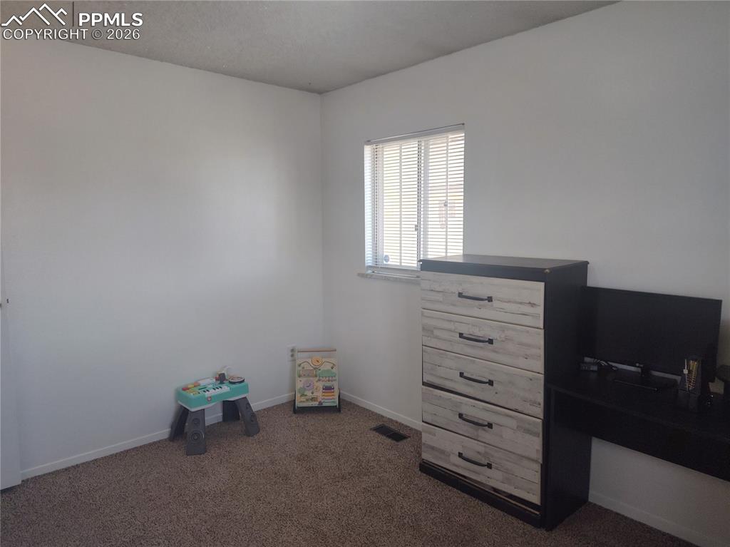 37 Massari Road Pueblo, CO 81001 - Photo 20 of 37 a room with a dresser and a window