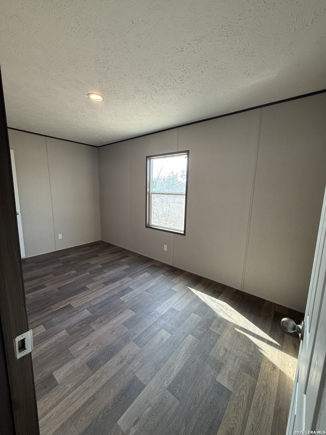 1390 Rendon Road Poteet, TX 78065 - Photo 12 of 22 an empty room with windows